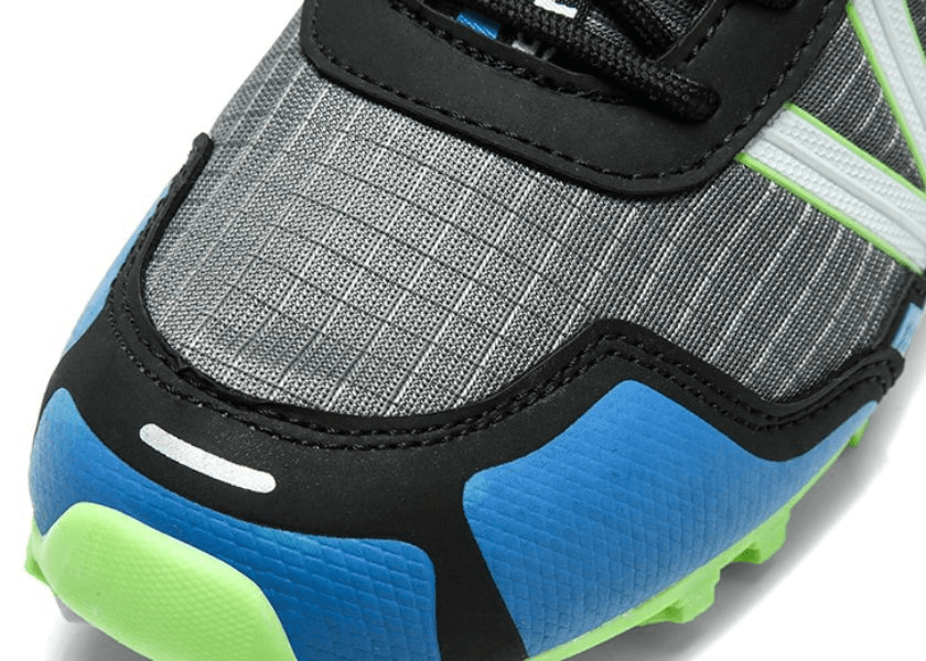 Close-up view of waterproof non-slip men's sneaker SF0780 showing vibrant blue and green EVA outsole with geometric design.